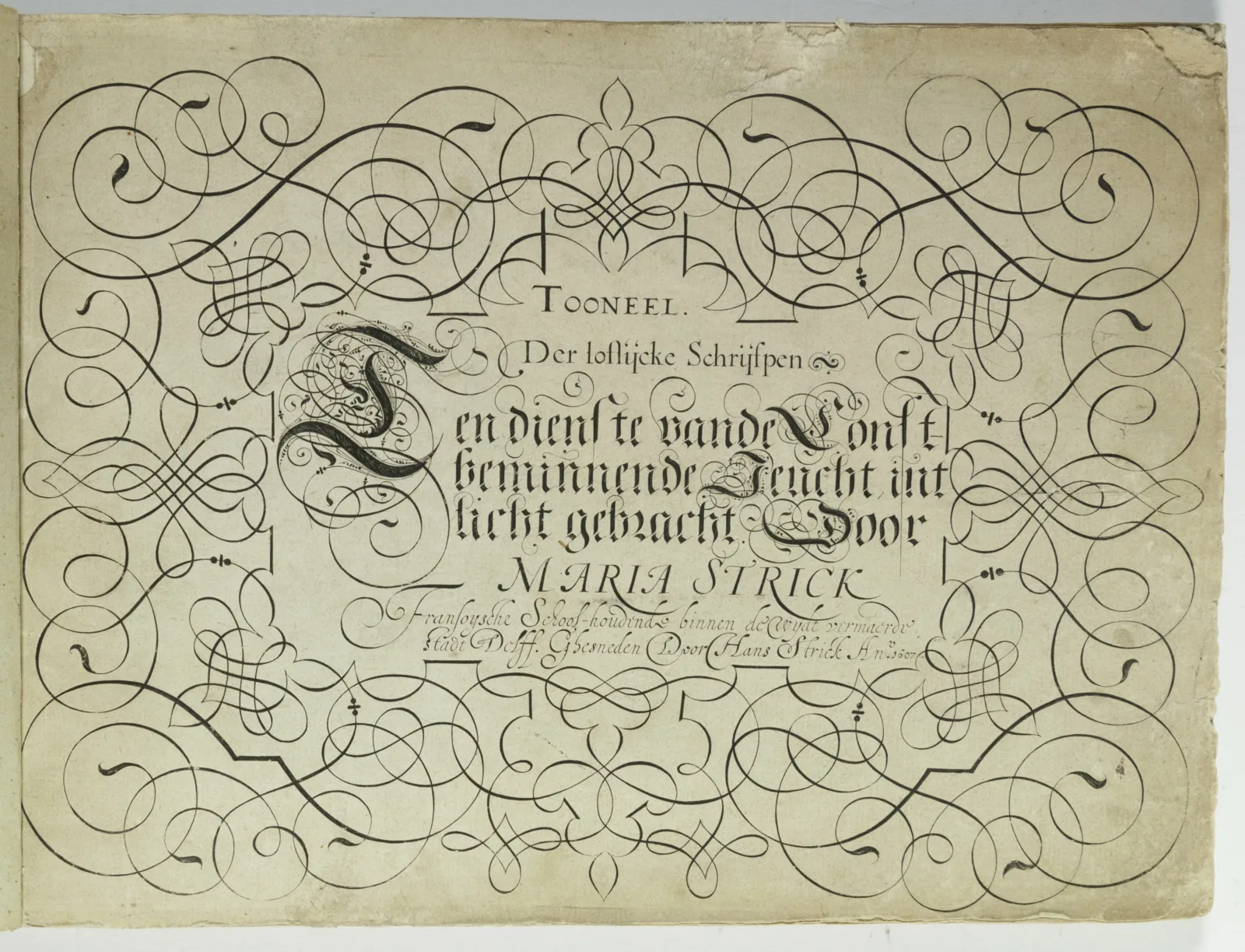 Calligraphic writing appears in the middle of the page. Under the writing are the words “Maria Strick.” Surrounding the handwriting are loops and flourishes.