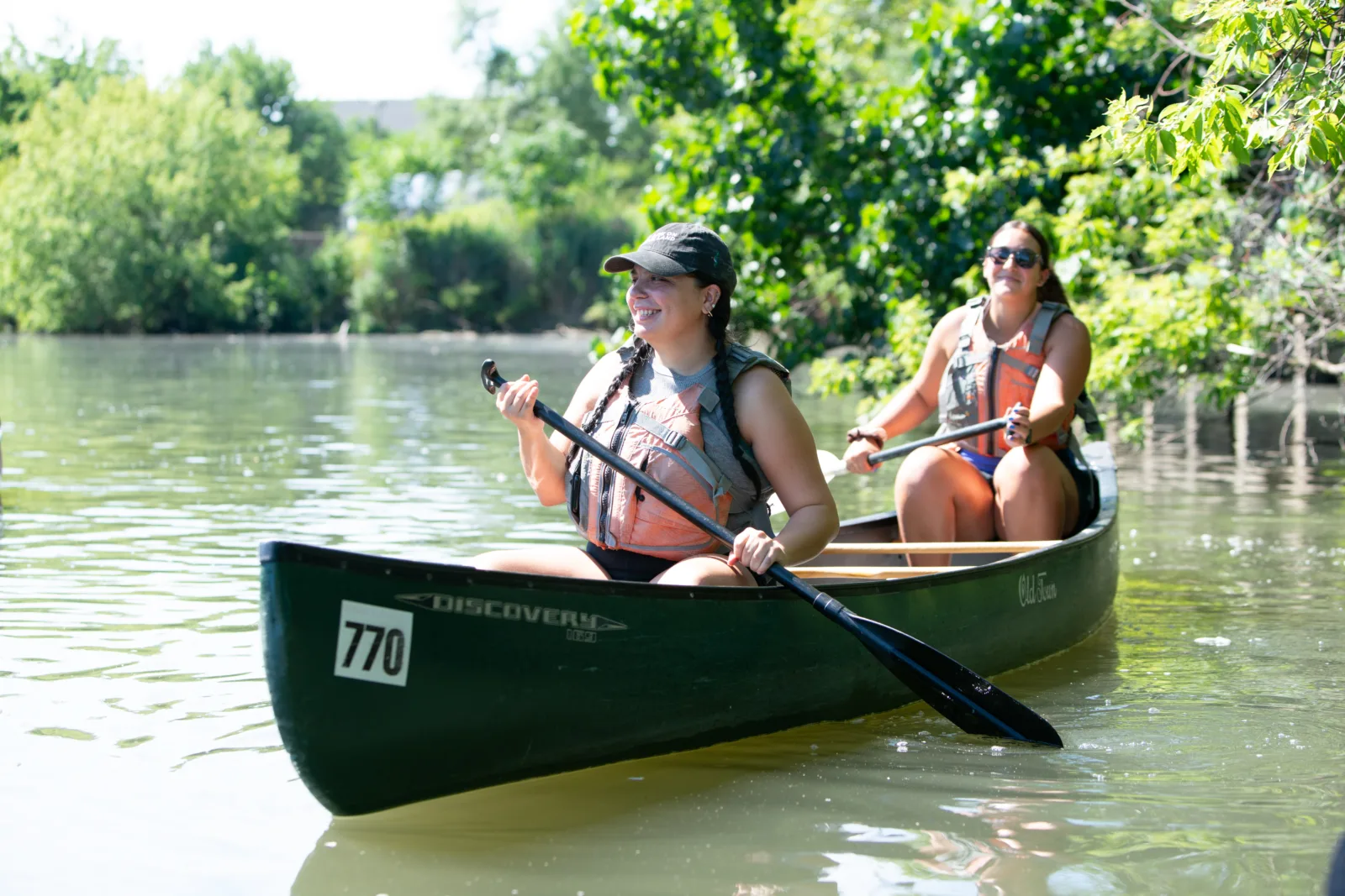 Smiling NCAIS participants paddle down the Chicago River.
