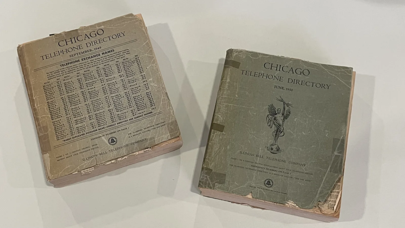 Covers of two Chicago telephone directories at the Newberry. The one on the left is from September 1949, and the one on the right is from June 1950.