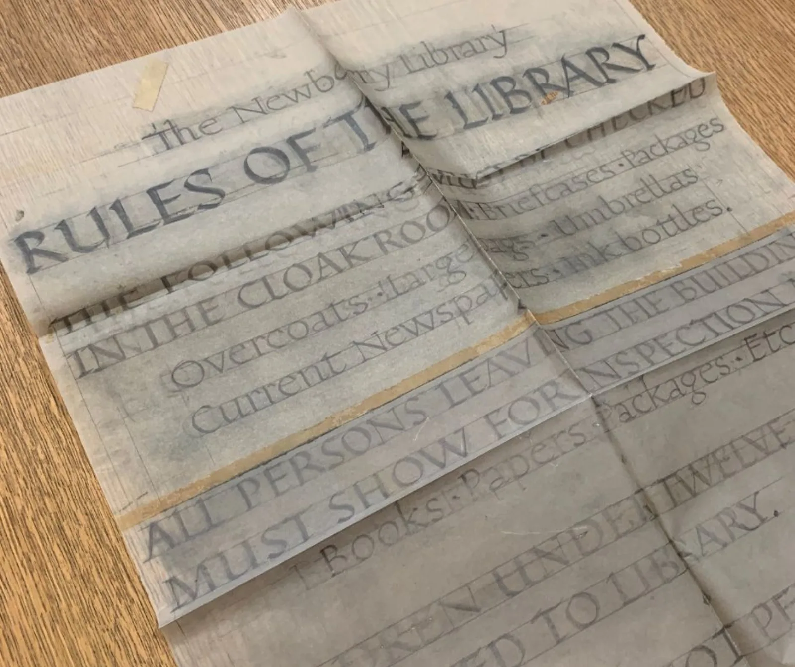 Hayes’s mockup of his “Rules of the Library” sign is done in pencil and on tracing paper.