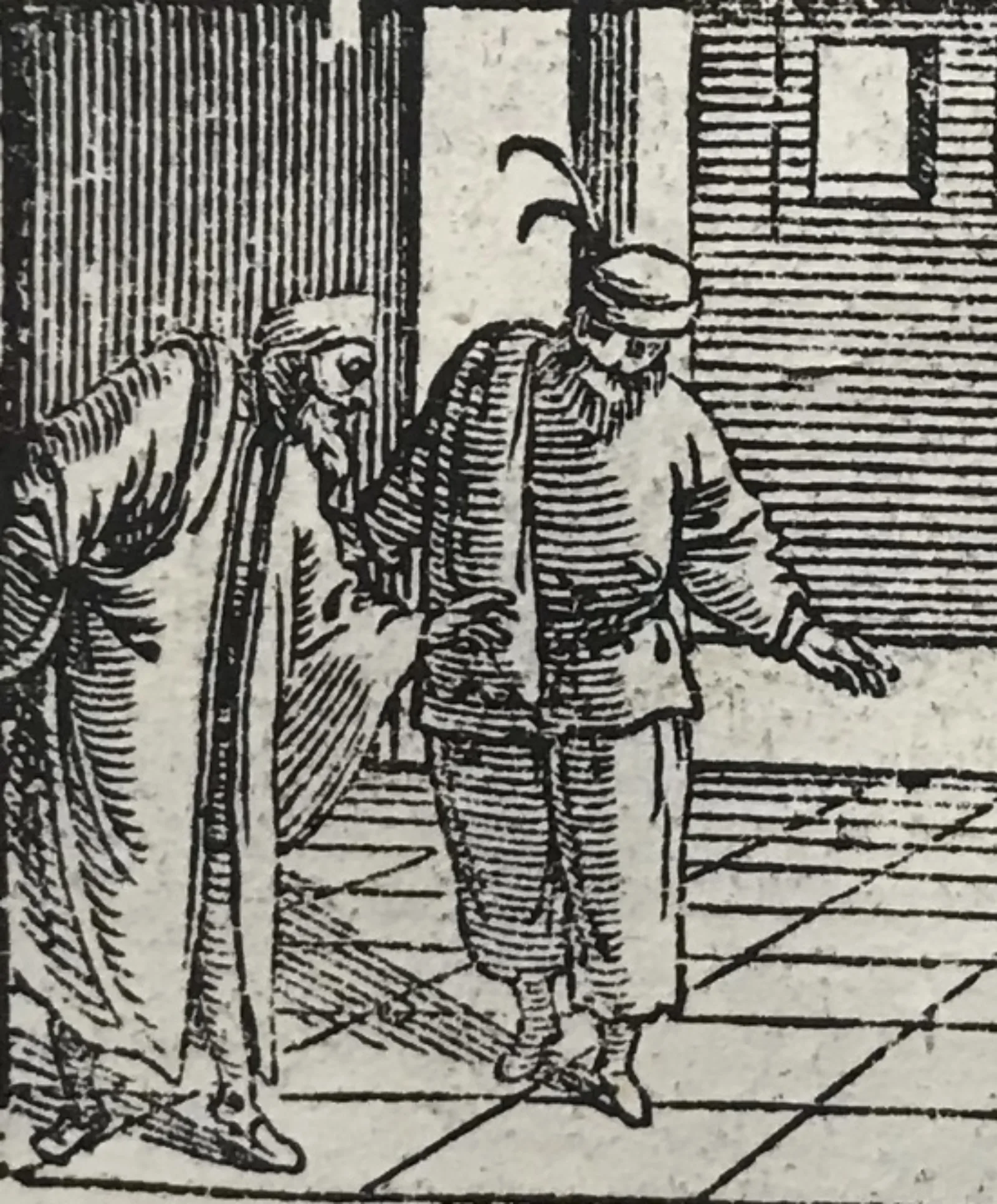 Detail of Pantalone and Zanni in the Newberry Missal. On the left is Pantalone, leaning forward with one hand behind and one in front. On the right is Zanni, seen with his loose, ankle-length trousers and a long-sleeved jacket of light-colored linen held with a belt.