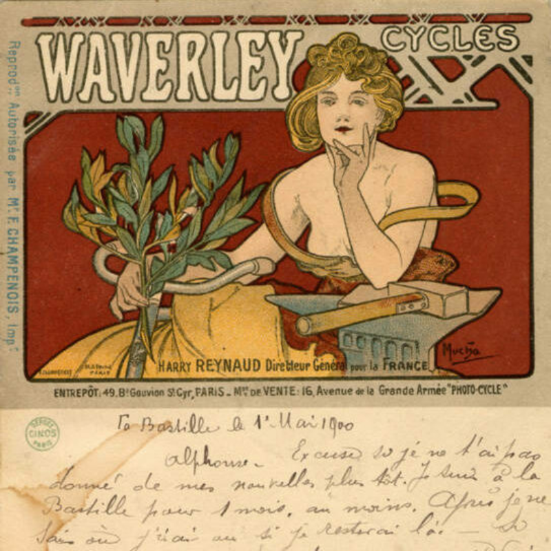 A woman in a yellow dress holds a few green branches with leaves in her hand. Above this illustration of her are the words "Waverley Cycles." Below the image is handwritten text, likely a postcard message that a previous owner wrote.